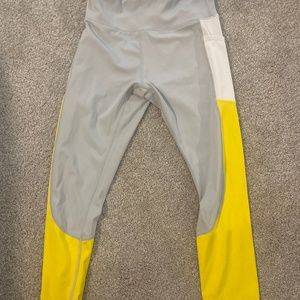 Yellow and gray nylon and spandex capri leggings